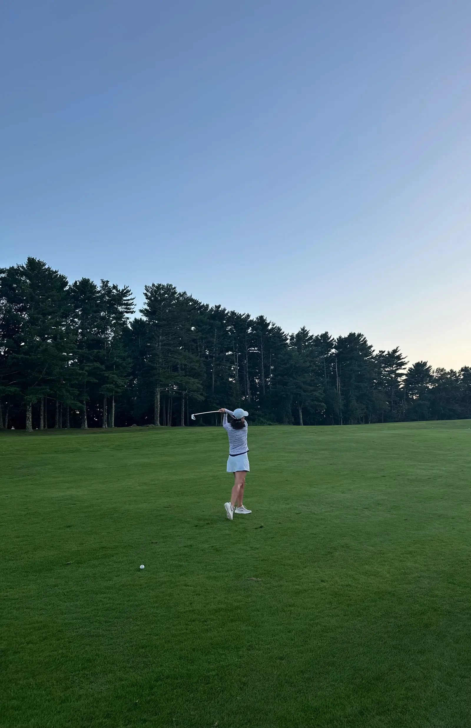 Chrissy mid-swing on the course